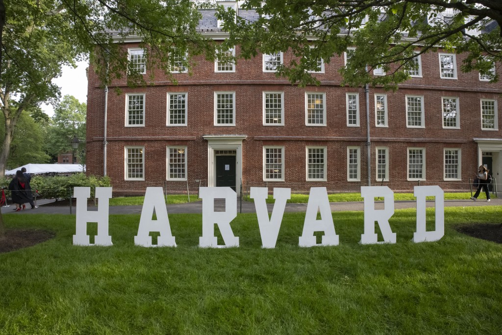 A Harvard sign is seen at the Harvard University campus in Boston, Massachusetts, on May 27, 2025. on September 19 the Trump administration imposed fresh restrictions on Harvard's access to federal funds, opening a new front in its unprecedented crackdown on the prestigious US university. (Photo by Rick Friedman / AFP)