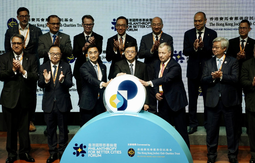 John Lee, fourth left foreground, is joined by delegates to the Philanthropy for Better Cities Forum. SING TAO John Lee, fourth left foreground, is joined by delegates to the Philanthropy for Better Cities Forum. SING TAO