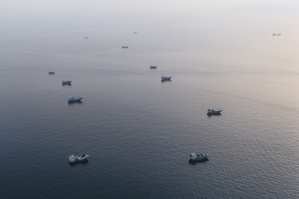 Boats anchored off Oman’s northern Musandam Peninsula near the Strait of Hormuz on June 27, 2026. (AFP)