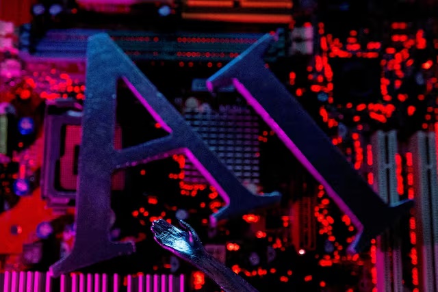 AI (Artificial Intelligence) letters and robot hand are placed on computer motherboard in this illustration created on June 23, 2023. REUTERS/Dado Ruvic/Illustration/File Photo