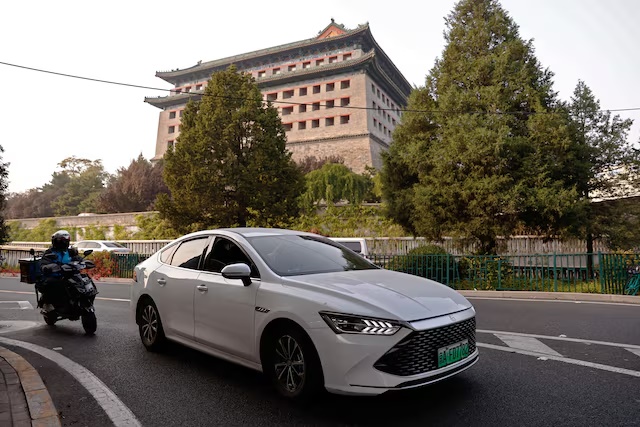 A BYD's electric vehicle (EV) Qin moves on a street in Beijing, China October 31, 2023. REUTERS/Tingshu Wang