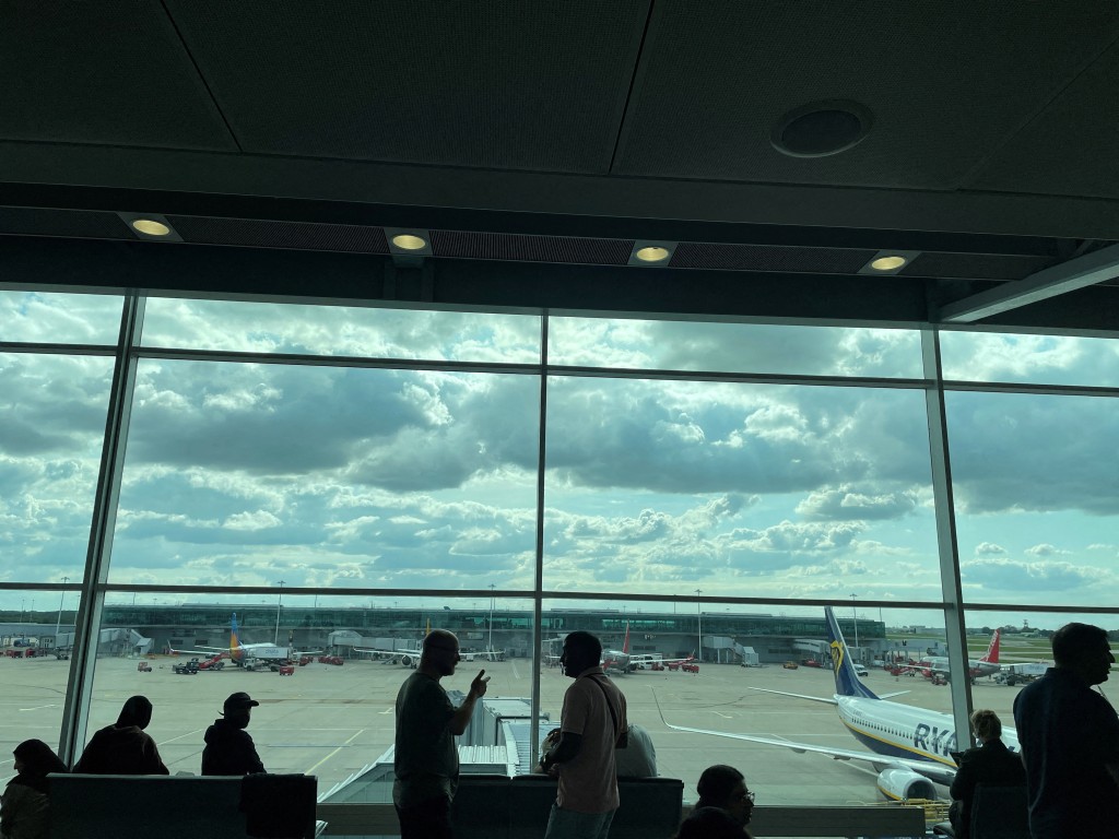 FILE PHOTO: Passengers awaiting news on cancelled or delayed flights at London Stansted Airport, Stansted, Britain August 28, 2023. REUTERS/Raphael Satter/File Photo