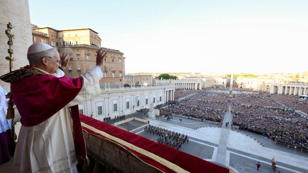 Newly elected Pope Leo XIV waves to pilgrims gathered in St. Peter's Square shortly after his election on May 8, 2025. Vatican Media via AP