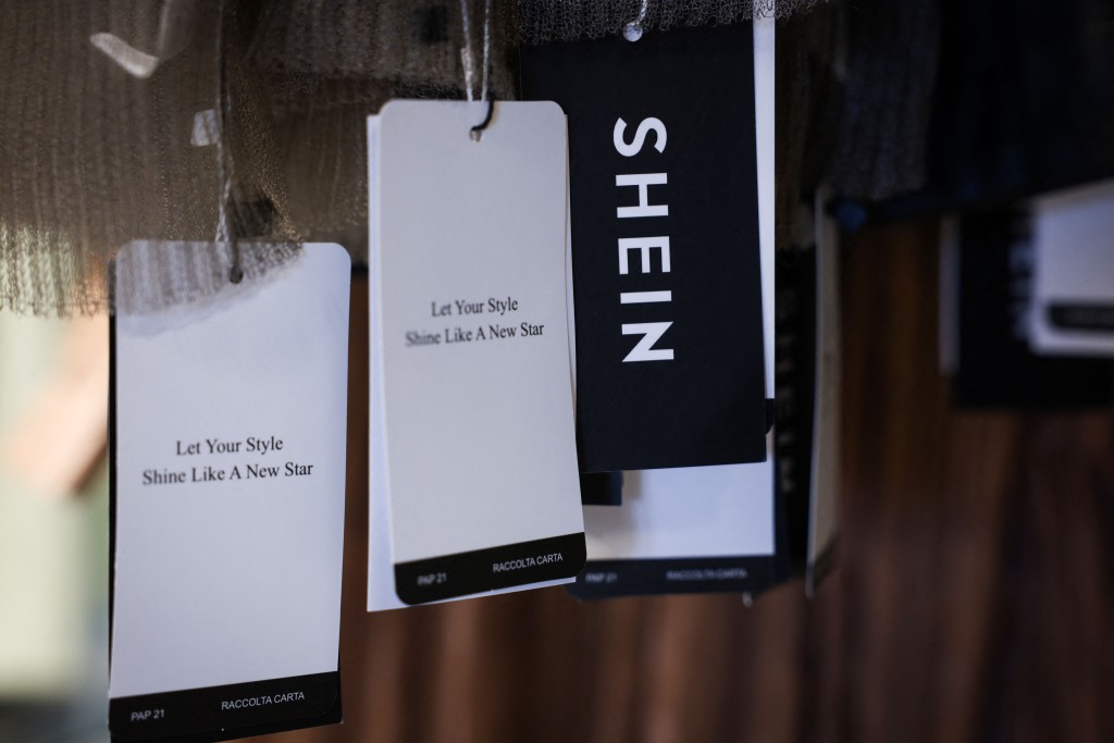 This photograph shows clothing labels of e-commerce giant Shein at the Bazar de l'Hotel de Ville (BHV) department store in Paris on March 19, 2026. AFP