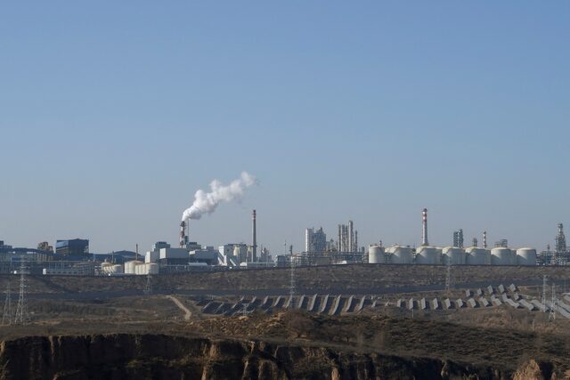 Solar panels lie in front of factories at Jinjie Industrial Park in Shenmu, Shaanxi province, China November 20, 2023. REUTERS/Colleen Howe/File Photo