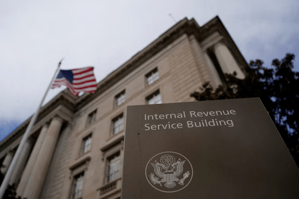 A flag waves outside the International Revenue Service Building in Washington, D.C., U.S., February 18, 2025. REUTERS/Kent Nishimura/File Photo