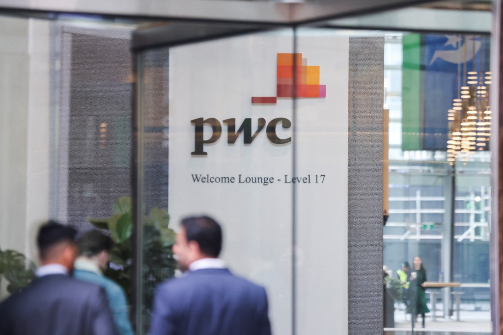 PwC sign is seen in the lobby of their offices in Barangaroo, Australia June 22, 2023. REUTERS