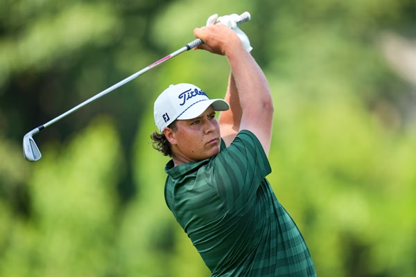 Detroit, Michigan, USA; Aldrich Potgieter plays his shot from the ninth tee during the final round of the Rocket Mortgage Classic golf tournament. Mandatory Credit: Aaron Doster-Imagn Images 