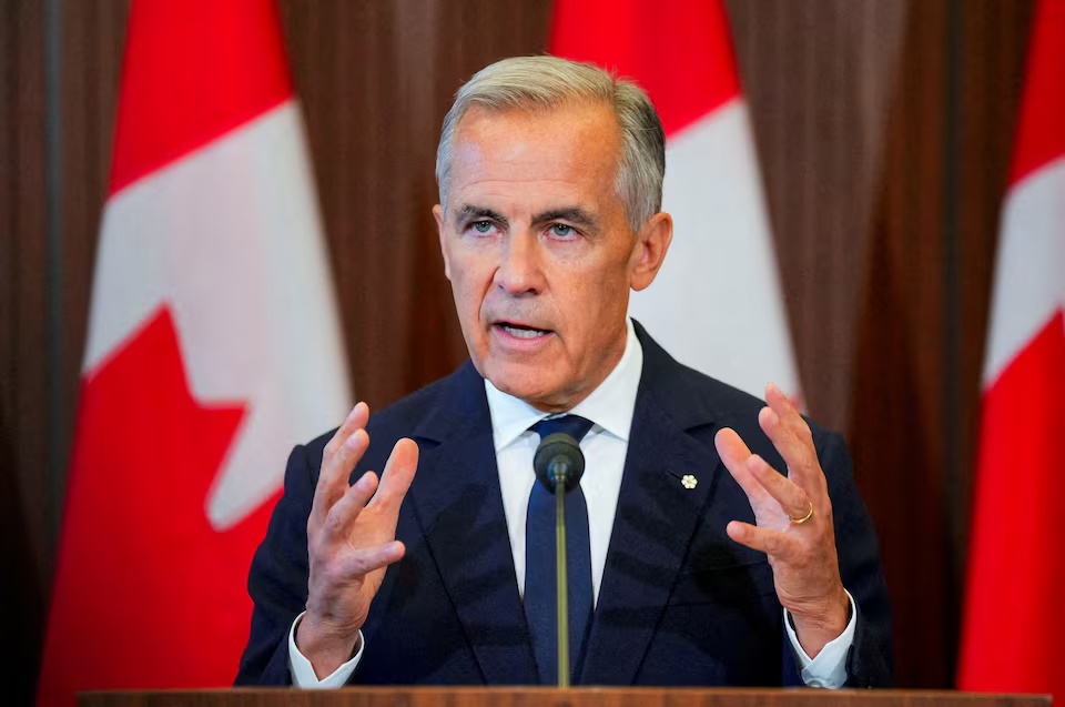 Canada’s Prime Minister Mark Carney speaks with the news media after he suspended trade negotiations with the United States, in Ottawa, Ontario, Canada August 22, 2026. REUTERS/Chris Tanouye/File Photo