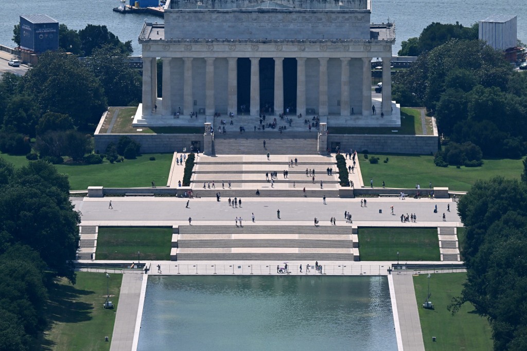 Photo by ALEX WROBLEWSKI / AFP  The Lincoln Memorial and reflecting pool are seen from the Washington Monument in Washington, DC, on June 30, 2026.