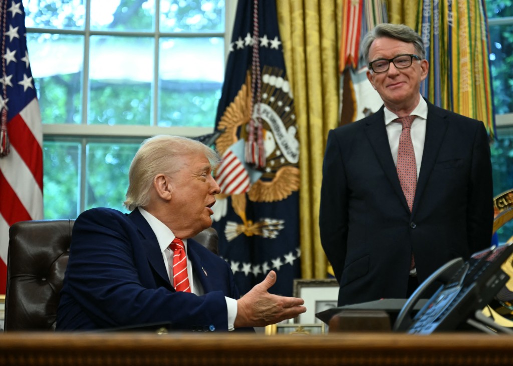 US President Donald Trump shakes hands with British ambassador to the United States Peter Mandelson after making a trade announcement in the Oval Office of the White House in Washington, DC, on May 8, 2025. (Photo by Jim WATSON / AFP)