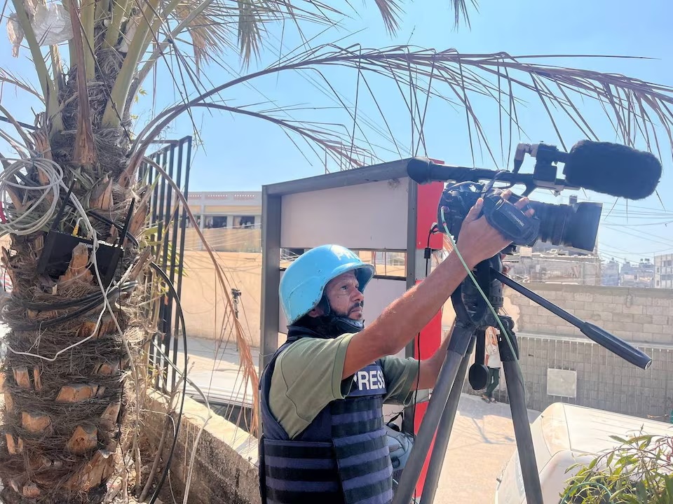 Palestinian cameraman Hussam al-Masri, who was a contractor for Reuters and killed in Israeli strikes on Nasser hospital on August 25, 2025, works at Nasser hospital, in Khan Younis in the southern Gaza Strip August 7, 2024. REUTERS/Stringer/ File Photo 