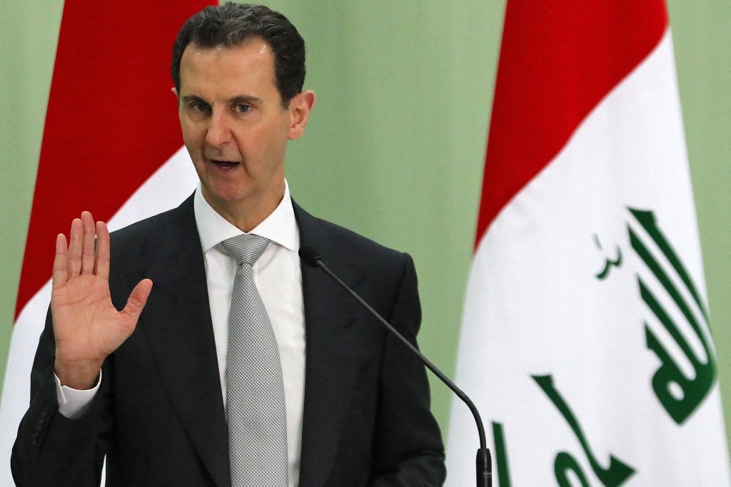 Photo by LOUAI BESHARA / AFP Syria's President Bashar al-Assad speaks during a press conference with Iraq's Prime Minister in Damascus on July 16, 2023.
