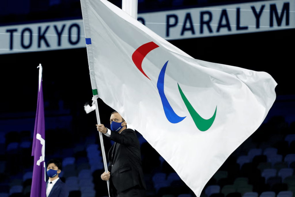 Tokyo 2020 Paralympic Games - The Tokyo 2020 Paralympic Games Closing Ceremony - Olympic Stadium, Tokyo, Japan - September 5, 2021. The International Paralympic Committee President Andrew Parsons waves the Paralympic flag during the closing ceremony REUTERS/Issei Kato/File Photo