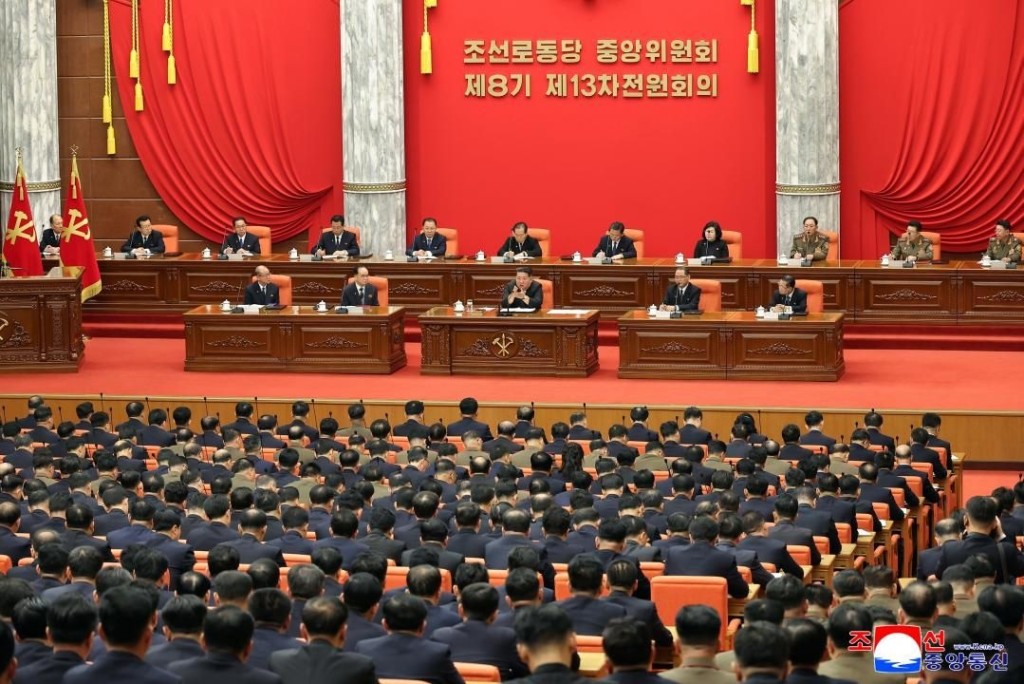In this photo provided by the North Korean government, North Korean leader Kim Jong Un, center, attends a plenary meeting of the Workers Party's Central Committee in North Korea, Tuesday, Dec. 9, 2025.  (Korean Central News Agency/Korea News Service via AP)