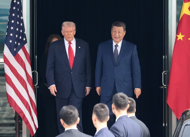 U.S. President Donald Trump and Chinese President Xi Jinping walk as they leave after a bilateral meeting at Gimhae International Airport, on the sidelines of the Asia-Pacific Economic Cooperation (APEC) summit, in Busan, South Korea, October 30, 2025. REUTERS/Evelyn Hockstein/File Photo
