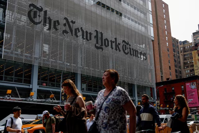 People walk by The New York Times building in Manhattan, New York City, U.S., September 16, 2025. REUTERS/Kylie Cooper