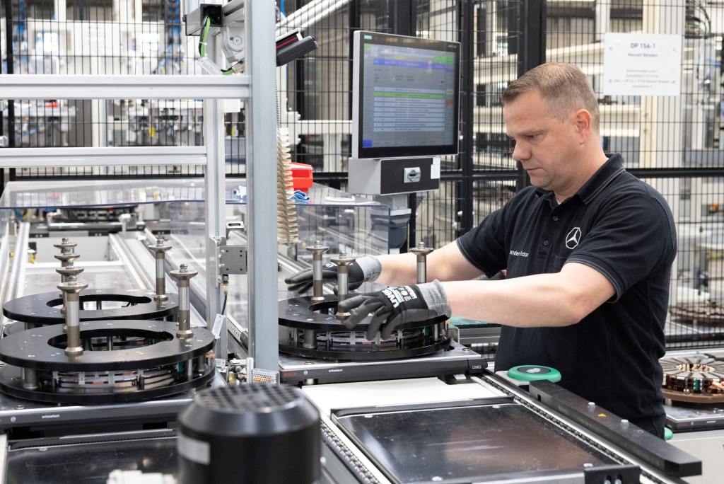 A worker assembles axial-flux motors for electric vehicles on an assembly line at the Mercedes-Benz engine factory in Berlin, Germany June 9, 2026. REUTERS