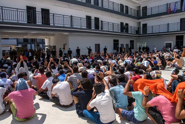 Victims of scam centers who were tricked or trafficked into working in Myanmar, stuck in limbo at a compound inside the KK Park, a fraud factory, and a human trafficking hub on the border with Thailand-Myanmar after a multinational crackdown on the compounds run by criminal gangs, operated by the Karen Border Guard Force (BGF) in Myawaddy, Myanmar, February 26, 2025. REUTERS/Stringer/File Photo