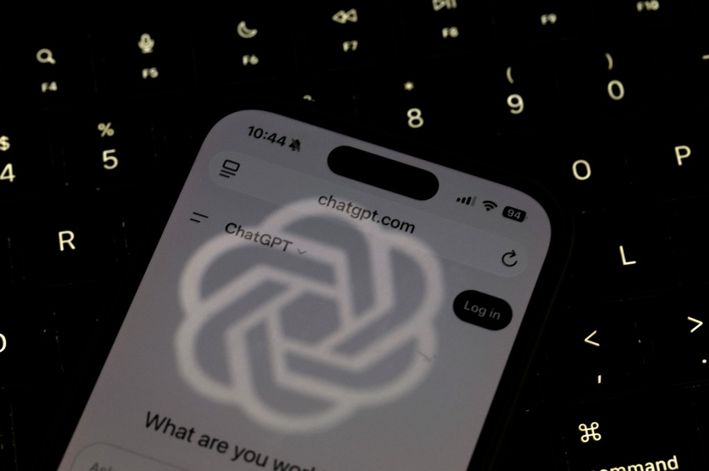 OpenAI logo is reflected on the screen of a smartphone with the ChatGPT website displayed on May 20, 2026 in Los Angeles, California. AFP