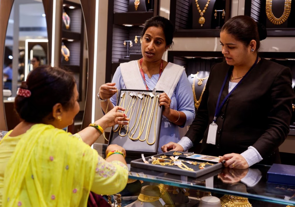 A customer looks at gold chains at a jewellery store in Mumbai, India, March 20, 2025. REUTERS