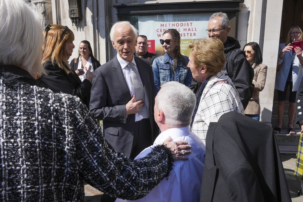 Brian Langstaff, center, with campaigners outside Central Hall in London, on May 20.Photographer: Jeff Moore/PA images/Getty Images Brian Langstaff, center, with campaigners outside Central Hall in London, on May 20.Photographer: Jeff Moore/PA images/Getty Images
