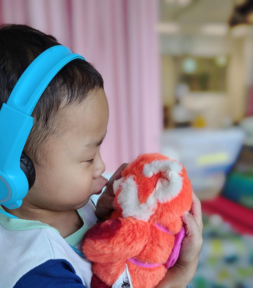 Kansas kissing his stuffed toy. From Facebook