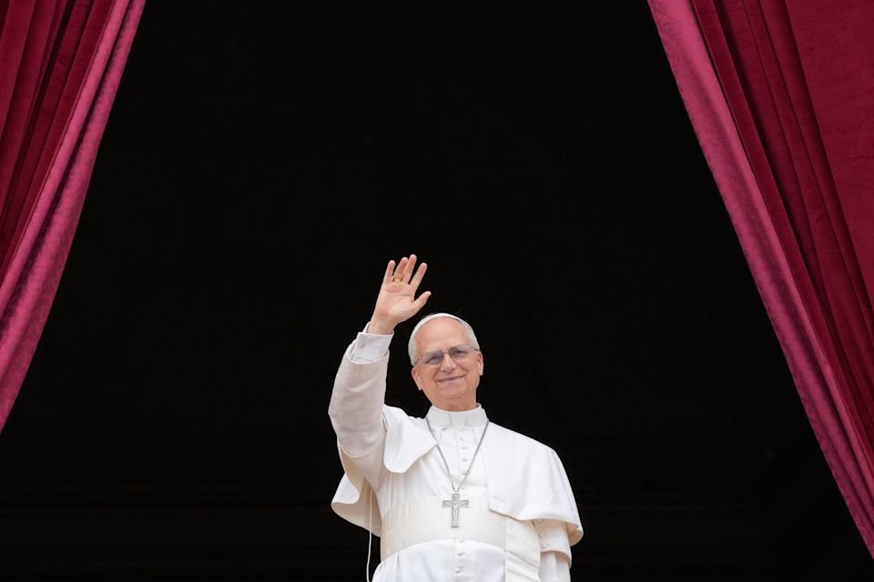Pope Leo XIV appears on the central balcony of St. Peter's Basilica at the Vatican to bless the crowd below on May 11, 2025. (AP Photo/Gregorio Borgia)