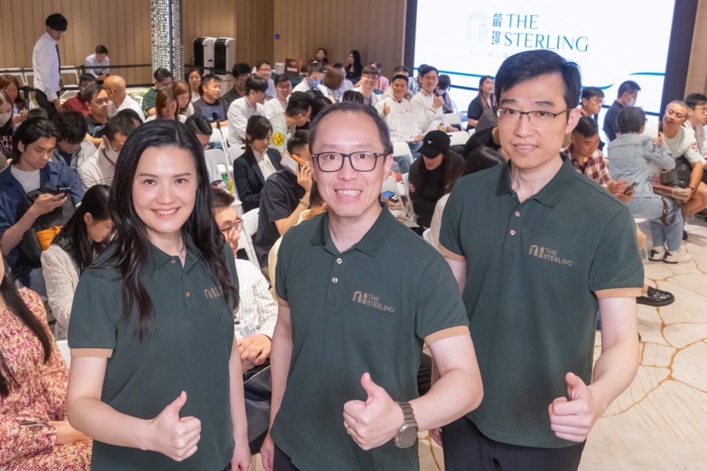 Jeffrey Sy, center, CR Land (Overseas) sales and marketing director Kong Jian, right,  and sales and marketing deputy director Cen Feifei