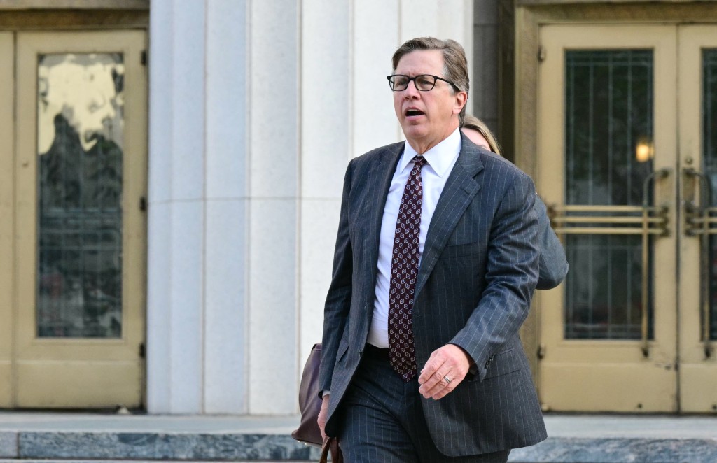 Photo by FREDERIC J. BROWN / AFP  Plaintiffs' attorney Mark Lanier leaves the Los Angeles Superior Court courthouse as the jury continues deliberations in a trial to determine whether social media companies deliberately designed their platforms to be addictive to children, in Los Angeles, on March 23, 2026.