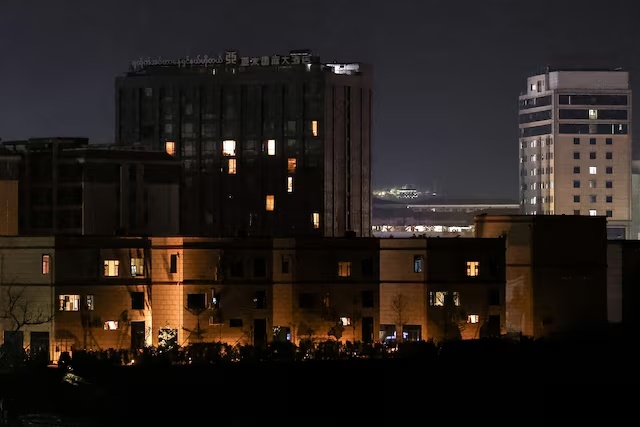 A general view of Shwe Kokko city, a casino, entertainment and tourism complex in Myanmar, seen from Thailand's side of the border, after Thailand cut electricity, internet and fuel supplies to five border areas in Myanmar, in an effort to curb scam centers, amid growing pressure on the illegal compounds that have ensnared vast numbers of multinational victims, in Mae Sot District, Tak province, Thailand, February 19, 2025. REUTERS/Chalinee Thirasupa