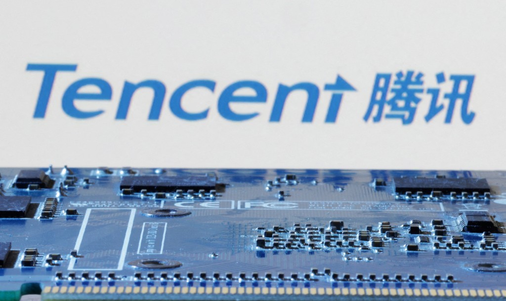 Tencent logo is seen near computer motherboard in this illustration taken January 8, 2024. REUTERS/Dado Ruvic/Illustration