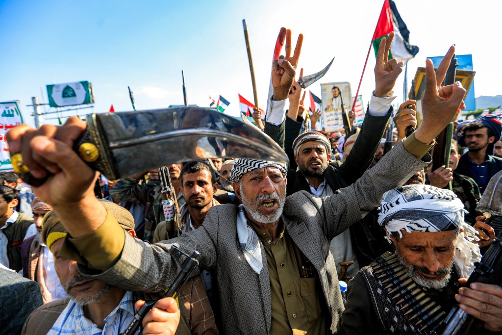 Supporters of Yemen's Huthis display weapons and chant slogans as they gather for a rally condemning Israel and in support of Palestinians, near the Saleh Grand Mosque in the Huthi-held capital Sanaa on October 3, 2025. (Photo by Mohammed HUWAIS / AFP)