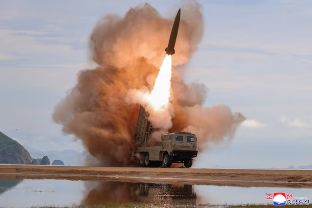 A rocket launcher fires a munition during tests in North Korea, June 25, 2026, in this picture released by North Korea's official Korean Central News Agency. KCNA via REUTERS/File Photo