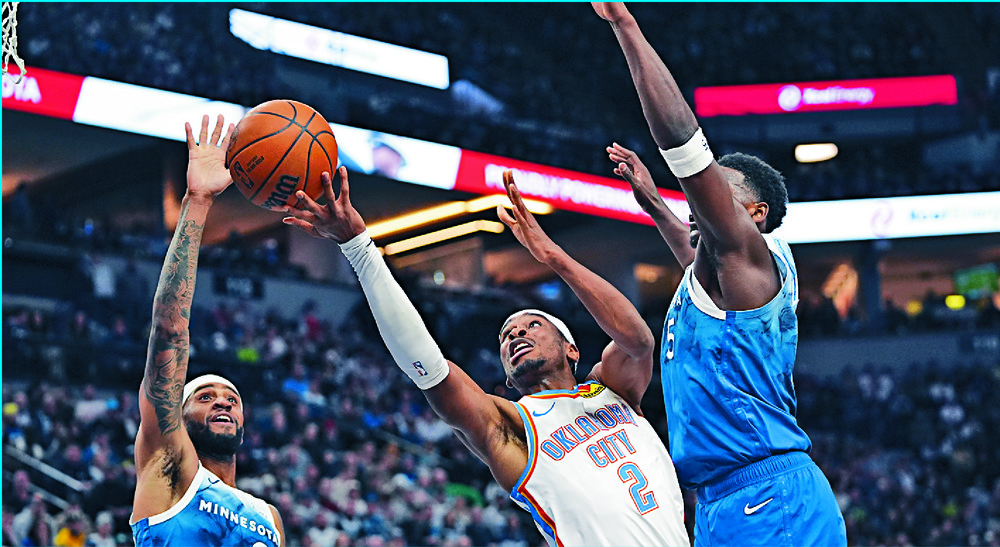 Shai Gilgeous-Alexander shoots against Nickeil Alexander-Walker, left, and Anthony Edwards. AP Shai Gilgeous-Alexander shoots against Nickeil Alexander-Walker, left, and Anthony Edwards. AP