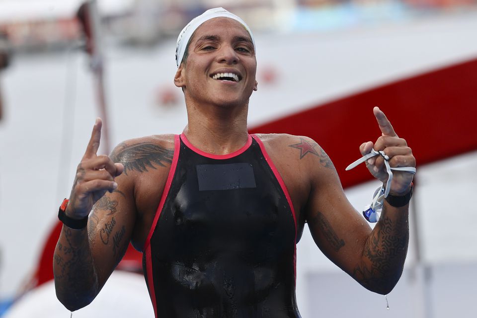 Ana Marcela Cunha of Brazil celebrates winning gold after the race. Ana Marcela Cunha of Brazil celebrates winning gold after the race.