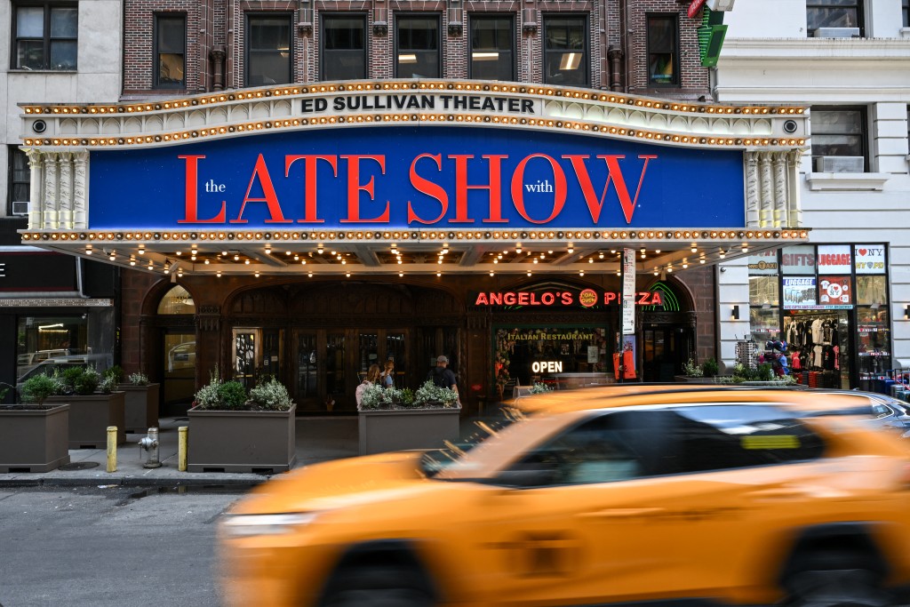 Photo by ANGELA WEISS / AFP  A marquee featuring "The Late Show with Stephen Colbert" is seen outside the Ed Sullivan Theater, where Colbert's show is produced, in New York City on July 18, 2025.