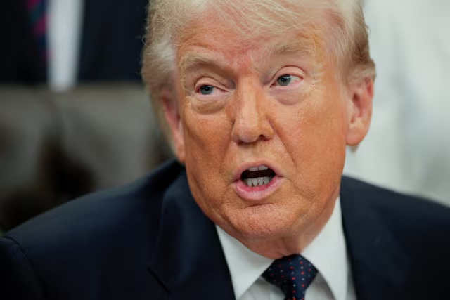 U.S. President Donald Trump speaks during an event to sign a memorandum in the Oval Office at the White House in Washington, D.C., U.S., May 5, 2026. REUTERS/Evan Vucci/File Photo
