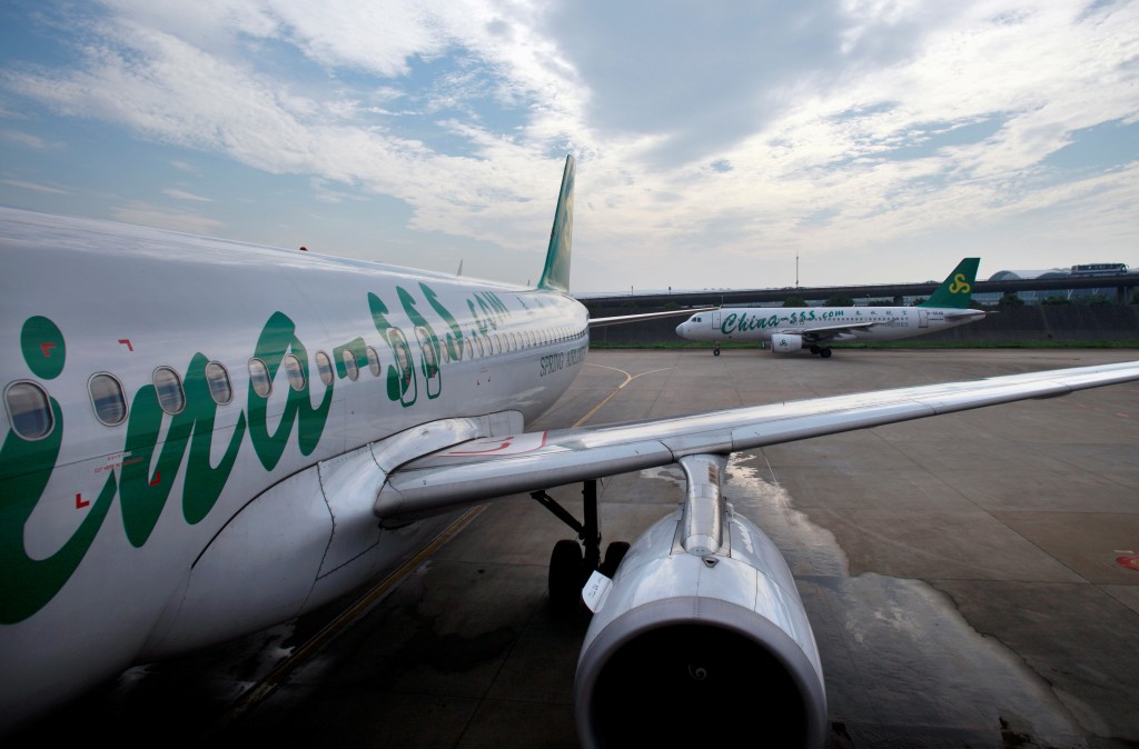 Spring Airlines' Airbus A320 aircraft are seen at Hongqiao airport in Shanghai on July 6, 2012. REUTERS/Aly Song