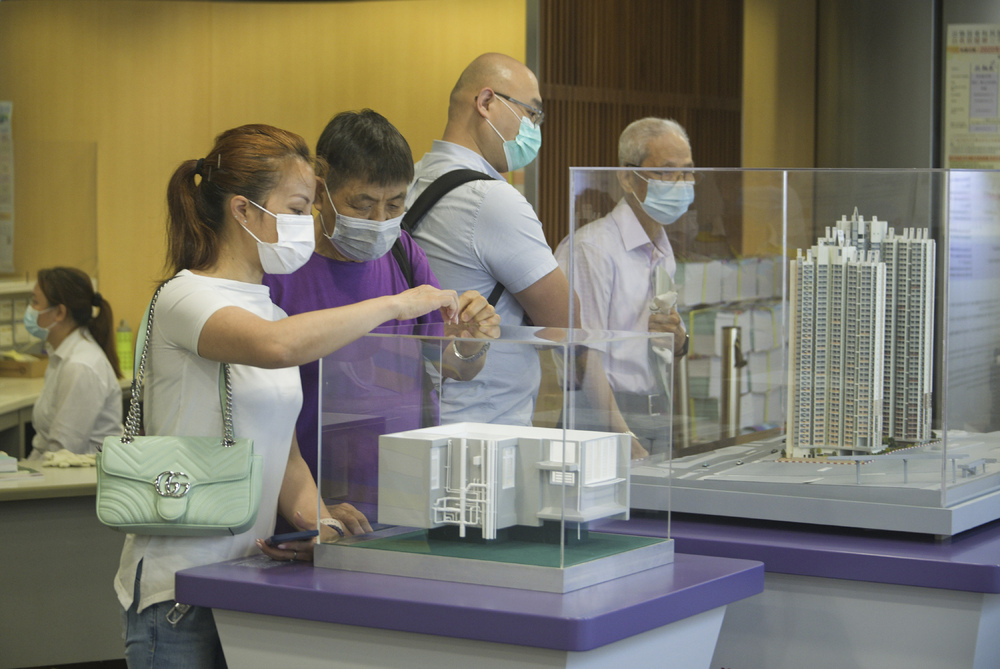 People view models of the Home Ownership Scheme flats. People view models of the Home Ownership Scheme flats.