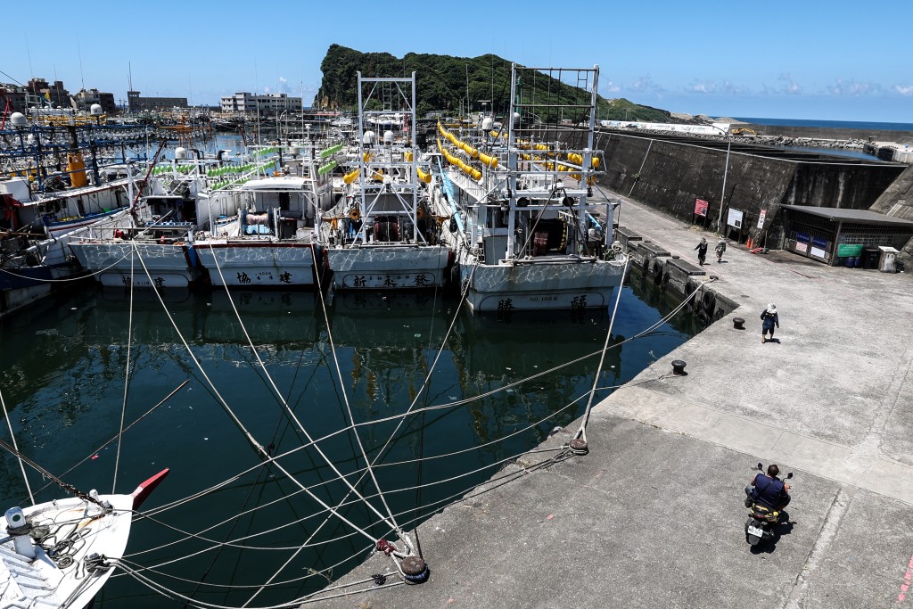 TOPSHOT - Fishing boats are secured at Shen'ao Harbour ahead of the arrival of Typhoon Bavi, in New Taipei City on July 9, 2026. (Photo by I-Hwa Cheng / AFP)