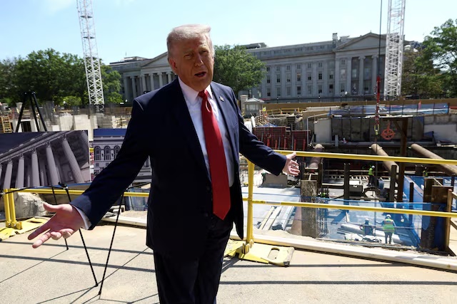U..S. President Donald Trump gestures at the site of ongoing construction of the planned White House ballroom in Washington, D.C., U.S., May 19, 2026. REUTERS/Kevin Lamarque TPX IMAGES OF THE DAY/File Photo