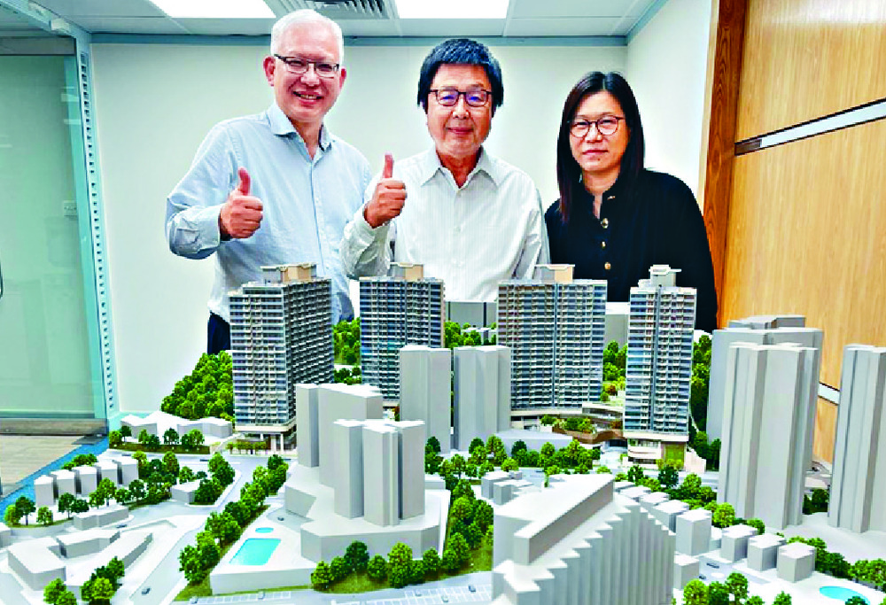 Francis Choi, center, and Raymond Lee give the project the thumb’s up.