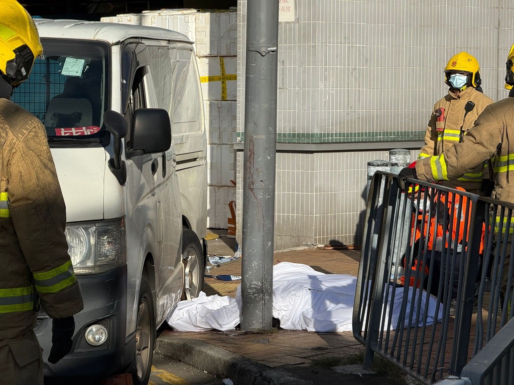 Rescue workers covered the bodies with white cloths.