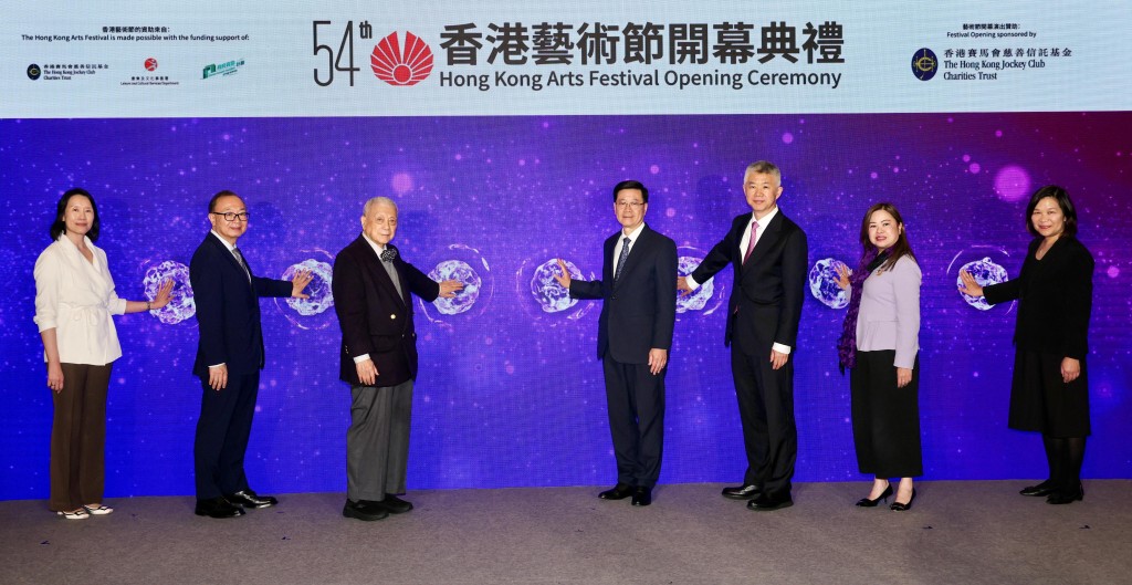 Officiating guests at the opening ceremony of the 54th Hong Kong Arts Festival include HKSAR Chief Executive John Lee (centre); Deputy Director of the Liaison Office of the Central People’s Government in the HKSAR, Sun Shangwu (3rd right); Secretary for the Culture, Sports and Tourism Bureau Rosanna Law (2nd right); Director of the Leisure and Cultural Services Department Manda Chan (1st left); Club Chairman The Hon Martin Liao (2nd left); HKAF Chairman Lo Kingman (3rd left); and HKAF Executive Director Flora Yu (1st right). Officiating guests at the opening ceremony of the 54th Hong Kong Arts Festival include HKSAR Chief Executive John Lee (centre); Deputy Director of the Liaison Office of the Central People’s Government in the HKSAR, Sun Shangwu (3rd right); Secretary for the Culture, Sports and Tourism Bureau Rosanna Law (2nd right); Director of the Leisure and Cultural Services Department Manda Chan (1st left); Club Chairman The Hon Martin Liao (2nd left); HKAF Chairman Lo Kingman (3rd left); and HKAF Executive Director Flora Yu (1st right).
