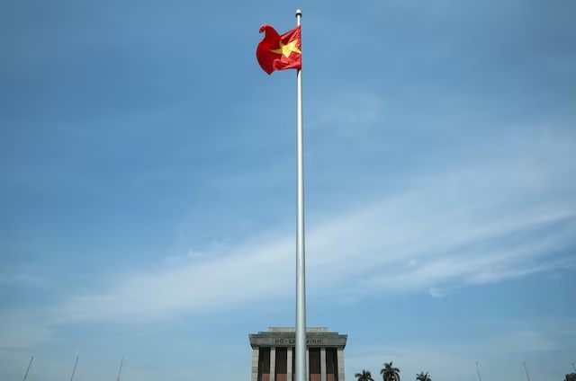 A Vietnamese flag flutters on the day Chinese President Xi Jinping visits the Ho Chi Minh Mausoleum during his visit to Hanoi, Vietnam, April 15, 2025. REUTERS/Athit Perawongmetha/Pool 