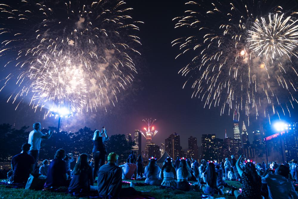 Spectators watch from the Queens borough of New York as fireworks are launched over the East River and the Empire State Building during the Macy's 4th of July Fireworks show, Sunday, July 4, 2021. Spectators watch from the Queens borough of New York as fireworks are launched over the East River and the Empire State Building during the Macy's 4th of July Fireworks show, Sunday, July 4, 2021.