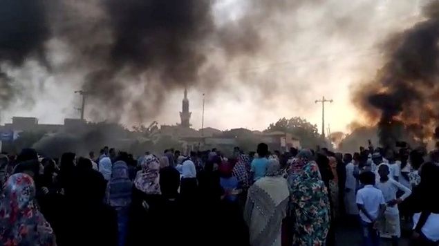 People gather on the streets as smoke rises in Kartoum, Sudan, amid reports of a coup, October 25, 2021. People gather on the streets as smoke rises in Kartoum, Sudan, amid reports of a coup, October 25, 2021.