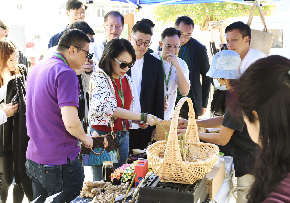 Chris Tang, left, checking some of the goods for sale, says Shau Tau Kok's opening day went smoothly. SING TAO Chris Tang, left, checking some of the goods for sale, says Shau Tau Kok's opening day went smoothly. SING TAO