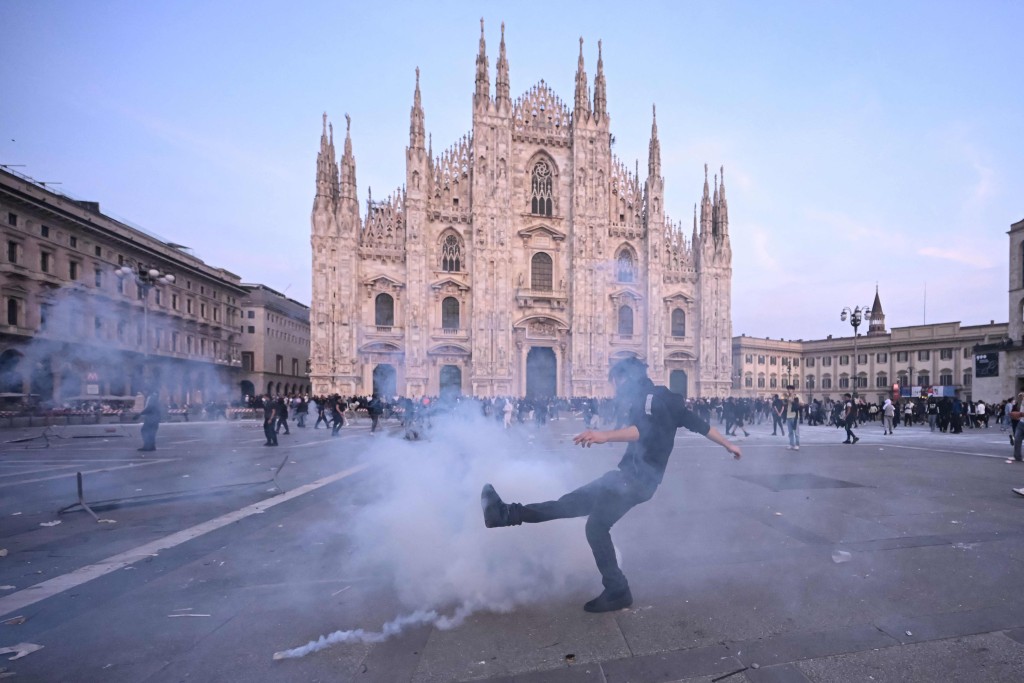 Protesters gather to demonstrate against the high cost of living in Milan on October 17 (AFP)